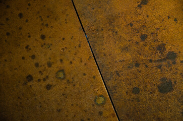 Rusty wall background. Natural rust is yellow-brown in color.