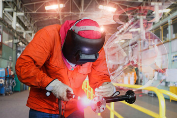 Industrial worker at factory welding metal steel pipe using tungsten Inert gas welding.