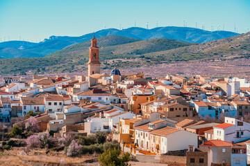 Panoramic view of Alcublas in Springtime surrounded by almond trees in blossom