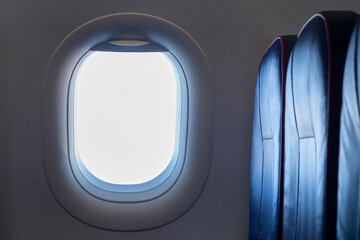 Blank clean illuminator or porthole of an airplane and empty seats