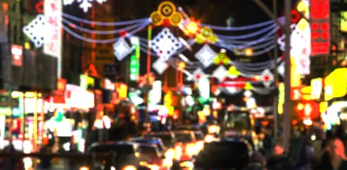 Fotobehang New York Blurred abstract lights of a busy New York City nighttime street scene in Chinatown  © deberarr