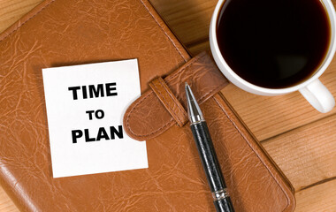 Business TIME TO PLAN . White stickers with text on the wooden background with coffee