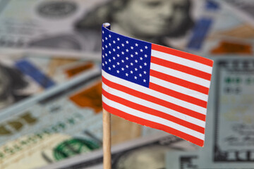 U.S. 100 dollar banknote on american flag background