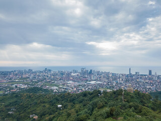 Drone view from the mountain to Batumi on a cloudy day