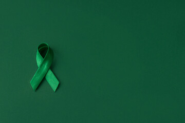 World bipolar day. Green ribbon on green background. Mental health awareness day, Depression,...