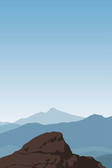 Mountain landscape. Rock. Peak. Mountains in a foggy haze. Blue sky. Background.