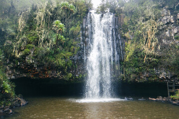 Fototapeta na wymiar Scenic view of Magura Waterfall and Queen caves at Aberdare National Park, Kenya