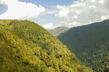 Fototapeta premium Scenic view of a valley landscape with sky at Aberdare National Park, Kenya
