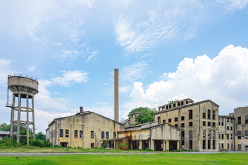 Fototapeta premium The old paper mill used to produce paper and banknotes during World War II, transformed into a new public attraction in Kanchanaburi, Thailand. (Cultural Economics with Tourism). Historical buildings.