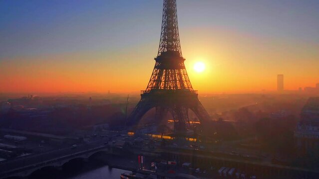 sunset behind eiffeltower in Paris