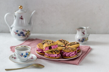 French morning tea party with homemade marshmallows with gourmet cookies on a light background, pale pink textile