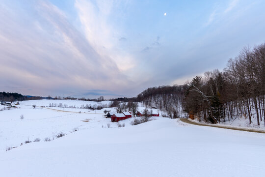 Photograph of a farm during a winter sunrise