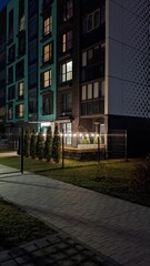 cosy decorated by garland balcony in the city at night