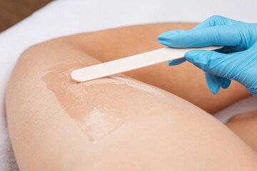 Elos epilation hair removal procedure on a woman’s body. Beautician doing laser rejuvenation in a beauty salon. Removing unwanted body hair. Hardware ipl cosmetology