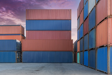Stack of containers in a harbor. Shipping containers stacked on cargo ship. Background of Stack of...