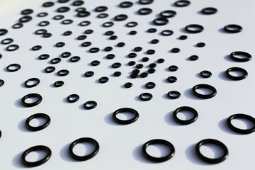 black and white background, plastic circles of different diameters, black on white background, abstration
