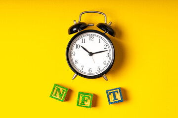 Clock and wood cube with NFT concept.