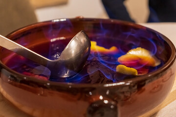Making burnt rum cocktail from Catalonia, typically known as 