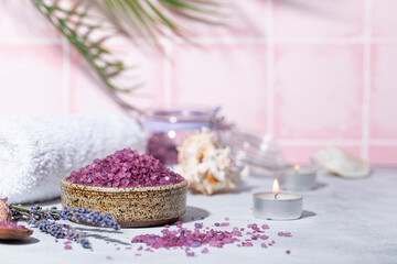 Fototapeta na wymiar Purple bath salt with lavender, towel and candles