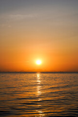 Fototapeta na wymiar Seascape, sunset sky at the lake.