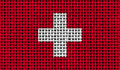 Switzerland flag on the surface of a metal lattice. 3D image