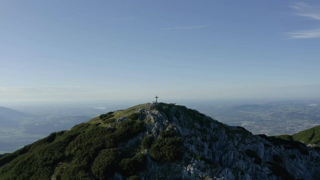 Aerial Drone Arc Around Summit Cross on mountain Untersberg, Austrian Alps