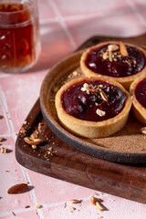 Cake tart with berry filling and nuts vertical photo