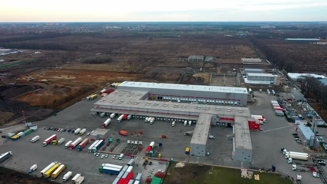 Aerial View Of Mail Delivery Terminal, Aerial View Of Cargo Terminal Of The Postal Service, Truck On The Industrial Warehouse, Distribution Warehouse With Trucks Awaiting Loading 