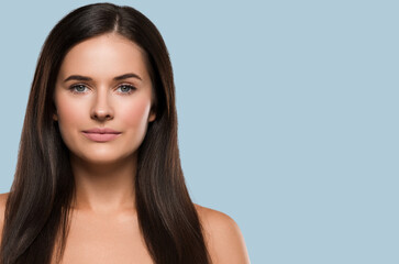 Obraz premium Natural brunette woman long hair casual makeup. Color background. Blue