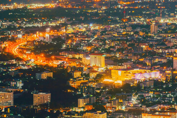 A long exposure photo taken from Chiang Mai, Top view of Chiang Mai cityscape at night, night time panorama building tourist amazing