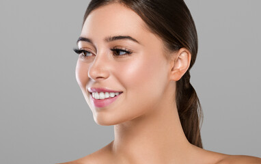Fototapeta premium Beautiful freckles woman healthy skin, hair brunette hairstyle concept. Color background.