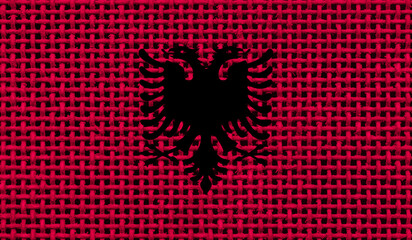 Albania flag on the surface of a metal lattice. 3D image
