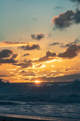 Fototapeta premium Misty Sunset over Waves on North Shore of Oahu