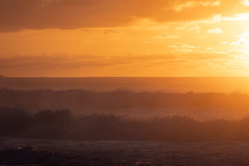 Misty Sunset over Waves on North Shore of Oahu