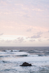 Stormy ocean waves during dusky sunset in coastal Oregon