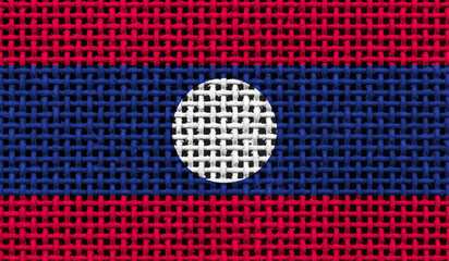 Laos flag on the surface of a metal lattice. 3D image