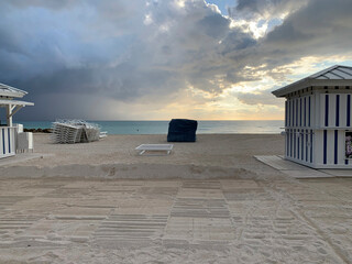 Stacked Lounge Chairs and Cabins End of Day, South Beach, FL, US