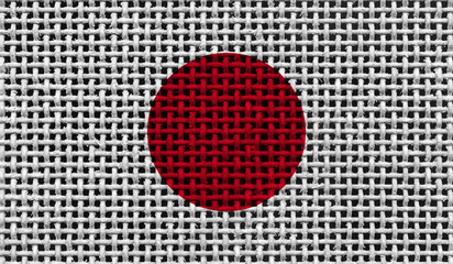 Japan flag on the surface of a metal lattice. 3D image