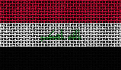 Iraq flag on the surface of a metal lattice. 3D image