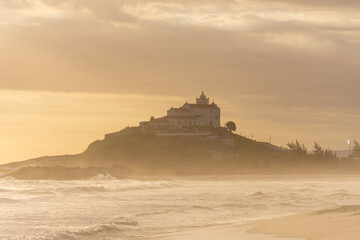 Beautiful sunset view from Itauna tropical beach to old church