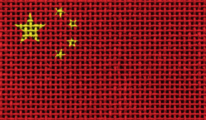 China flag on the surface of a metal lattice. 3D image