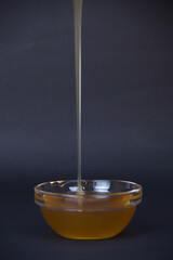 bee honey poured into a mini bowl