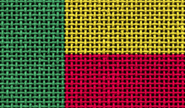 Benin flag on the surface of a metal lattice. 3D image