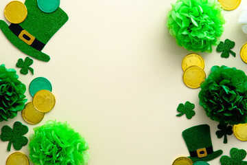 Fototapeta na wymiar St Patrick's Day card design. Flat lay, top view leprechauns hats, green decorations, gold coins, shamrocks clover on vintage background.