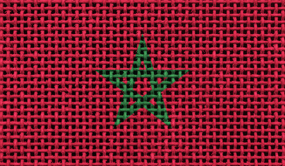 Morocco flag on the surface of a metal lattice. 3D image