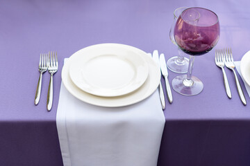 Table decorations for holidays and wedding dinner. Table set for holiday, event, party or wedding reception in outdoor restaurant.