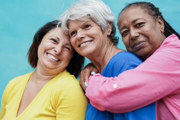 Portrait of happy multiracial senior women