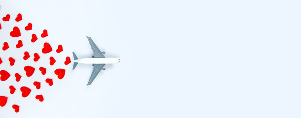 Background isolate with hearts and airplane. Valentine's Day. Selective focus.