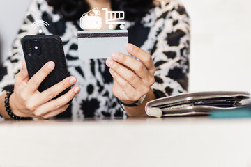 Woman holding cell phone and credit card, Online shopping concept.