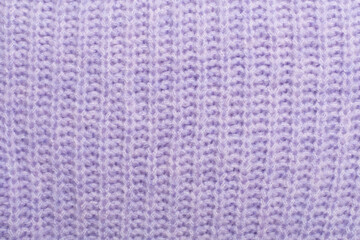 Knitted woolen sweater as background, closeup